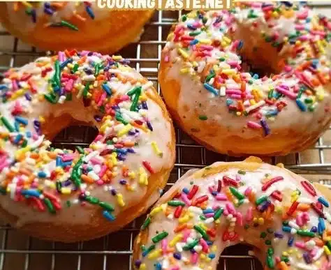 Delicious baked Funfetti donuts topped with colorful sprinkles and protein.