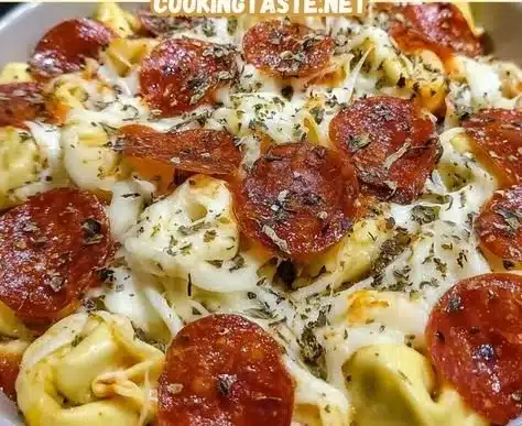 Cheese Tortellini Pepperoni Pizza 4 Cheese Tortellini Pepperoni Pizza with a cheesy and savory topping.