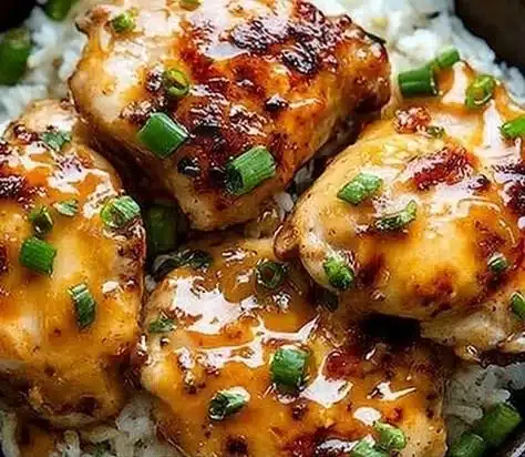 Skillet Bang Bang Chicken Thighs garnished and ready to serve.