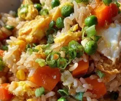 Colorful Breakfast Fried Rice served in a bowl with vegetables and eggs.