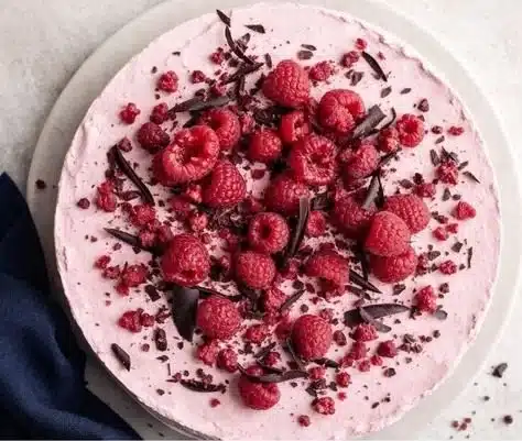 Decadent Chocolate Raspberry Mousse Cake with chocolate ganache and fresh raspberries