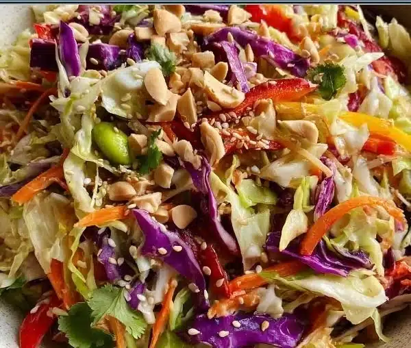 Crunchy Asian Cabbage Slaw in a bowl with vibrant colors and fresh ingredients.