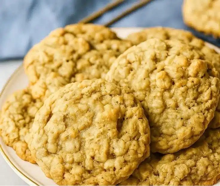 Chewy oatmeal cookies fresh out of the oven, golden brown and delicious.