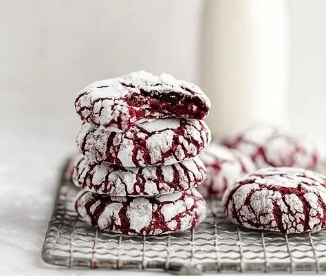 Red Velvet Crinkle Cookies 4 Delicious Red Velvet Crinkle Cookies on a baking tray, freshly made and ready to enjoy