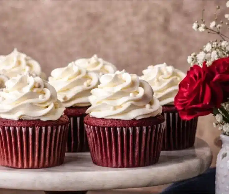 Delicious Red Velvet Cupcakes with creamy frosting on a decorative platter