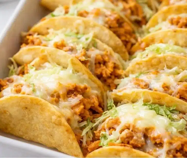 Rotisserie Chicken Tacos: Easy, Crispy & Delicious Recipe 7 Delicious rotisserie chicken tacos served on a plate with fresh toppings.