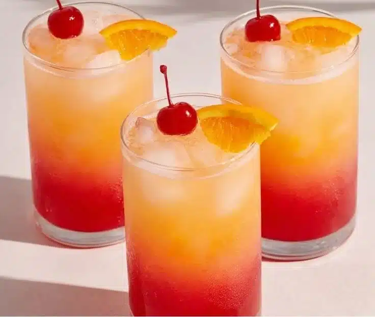 Colorful Tequila Sunrise cocktail layered with orange juice and grenadine