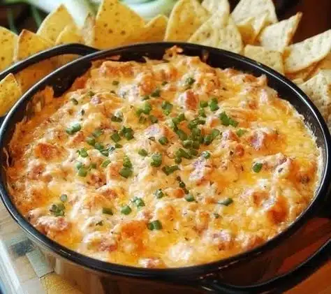 Southern-style Pimento Cheese Sausage Dip 9 Creamy Southern-style Pimento Cheese Dip with sausage served in a bowl.