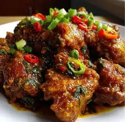 Delicious plate of Black Pepper Chicken garnished with fresh herbs