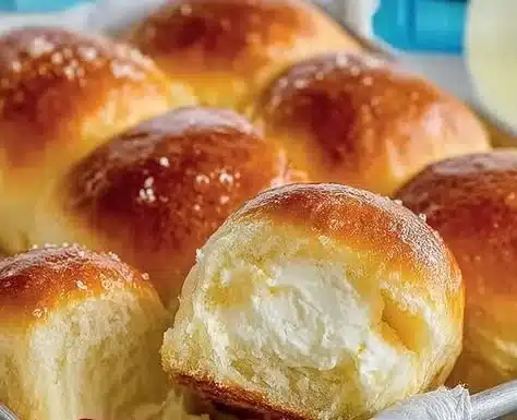 Soft and fluffy homemade dinner rolls ready for serving.