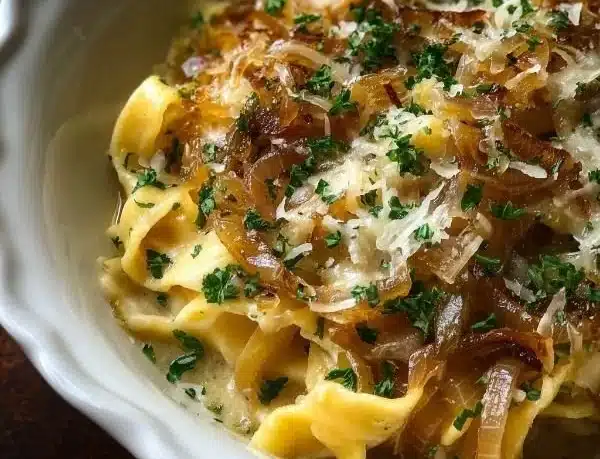 Delicious bowl of French Onion Soup Pasta topped with Gruyère cheese
