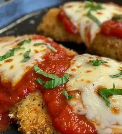 High protein chicken parmesan dish with cheese and sauce