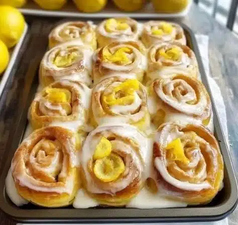 Delicious lemon rolls freshly baked and garnished with lemon zest