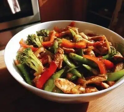 Colorful low calorie stir fry dish with fresh vegetables and lean protein