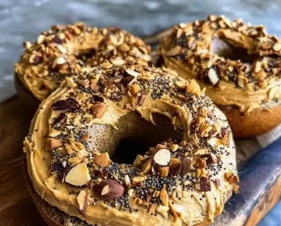 Protein Bagels with Almond Butter Swirl topped with almonds and chia seeds
