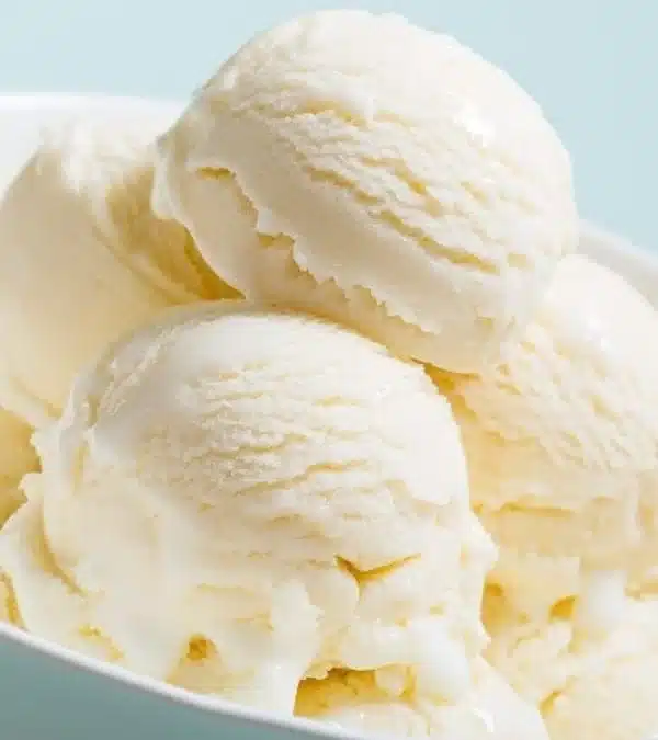 Delicious homemade vanilla ice cream in a bowl with fresh vanilla beans
